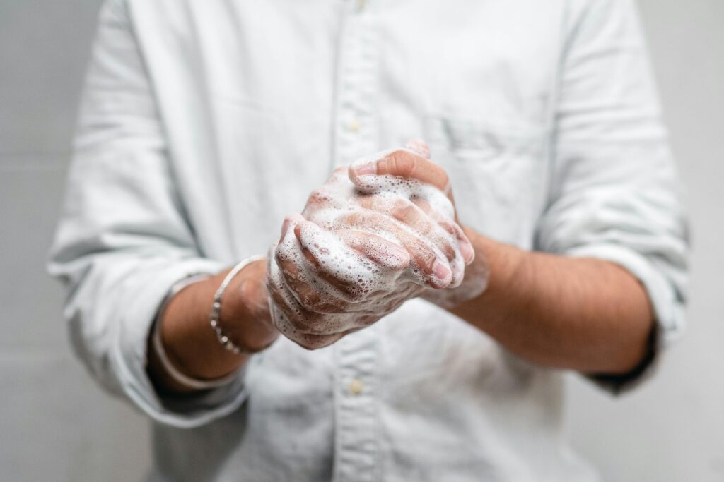 Close-up of hands lathered with soap for thorough cleaning and hygiene.